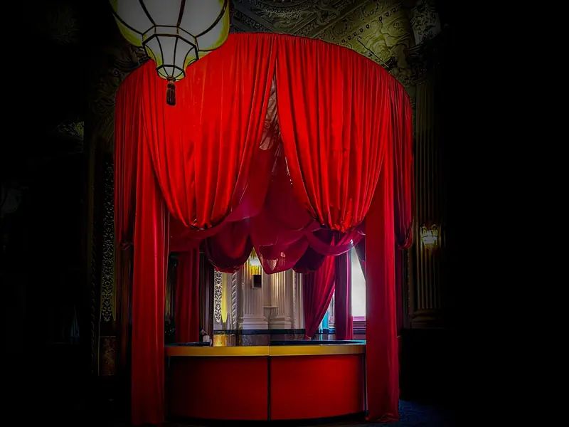 Bar under a red draped canopy at a high end event, designed and installed by the Mr Flavour team