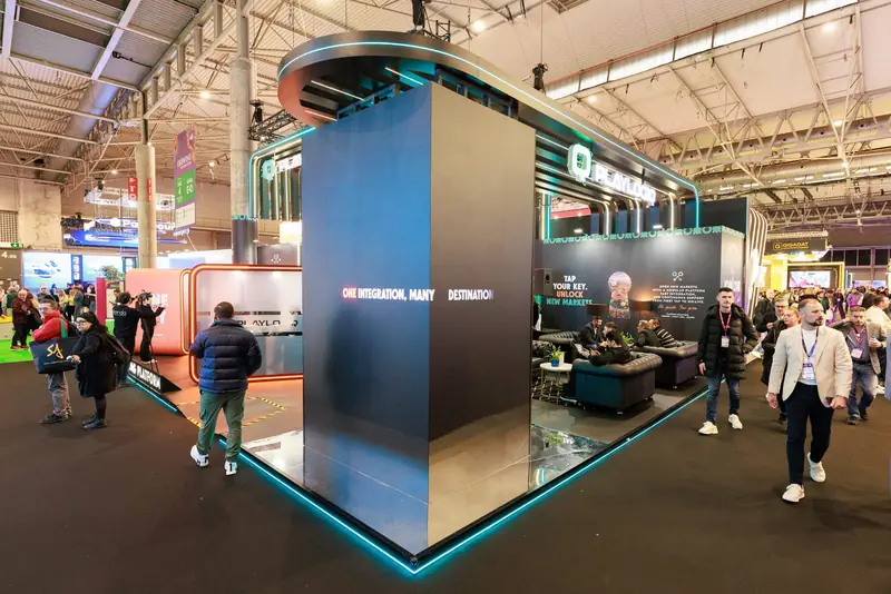 The full PlayLogiq exhibition stand at ICE with the Mr Flavour hospitality bar built into the brand world