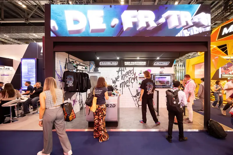The full R2D street art exhibition stand with graffiti walls and the Mr Flavour hospitality pod mid engagement