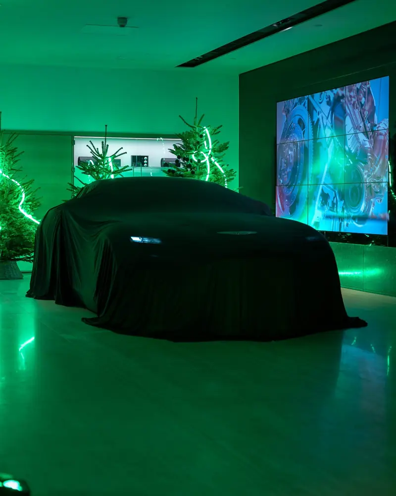 The new Aston Martin Vanquish under green light in the Mayfair showroom at its launch event