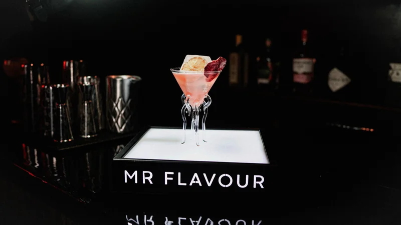 Pink jellyfish signature serve on a lit Mr Flavour plinth