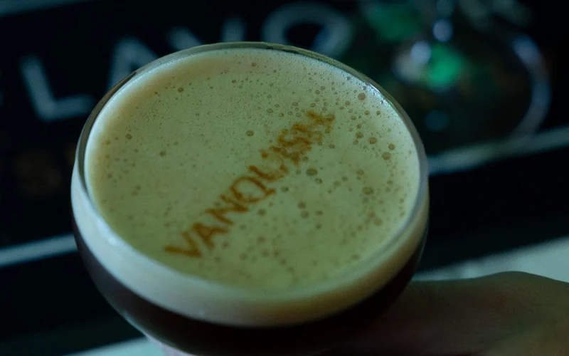 Espresso martini with VANQUISH printed onto the crema, served for the Aston Martin Vanquish launch
